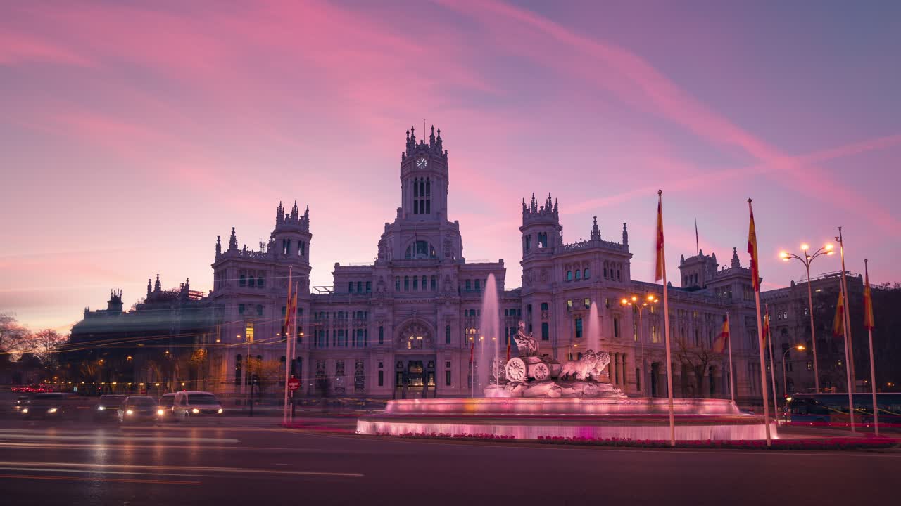Sunrise timelapse Madrid City Town Hall Casa de Correos and Cibeles square and fountain night to day time lapse