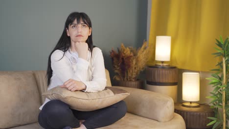 woman thinking about a topic at night at home.