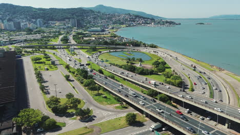 numerous vehicles at a massive intersection, depicting the bustling activity and urban congestion at a major crossroads