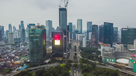 Aerial-hyperlapse-time-lapse-of-a-busy-traffic-in-modern-city-center-with-skyscrapers-towers-and-high-rise-buildings-in-Jakarta,-Indonesia,-Motion-Time-Lapse-Hyper-Lapse