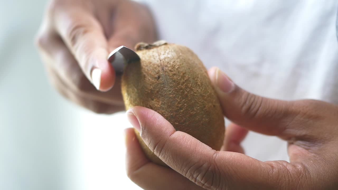 Peeling a Kiwi Fruit