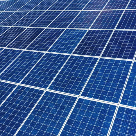 aerial view. top view on blue solar pannels. green energy. pannels on the roof.