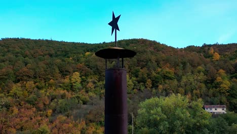 old industrial chimney with five point star