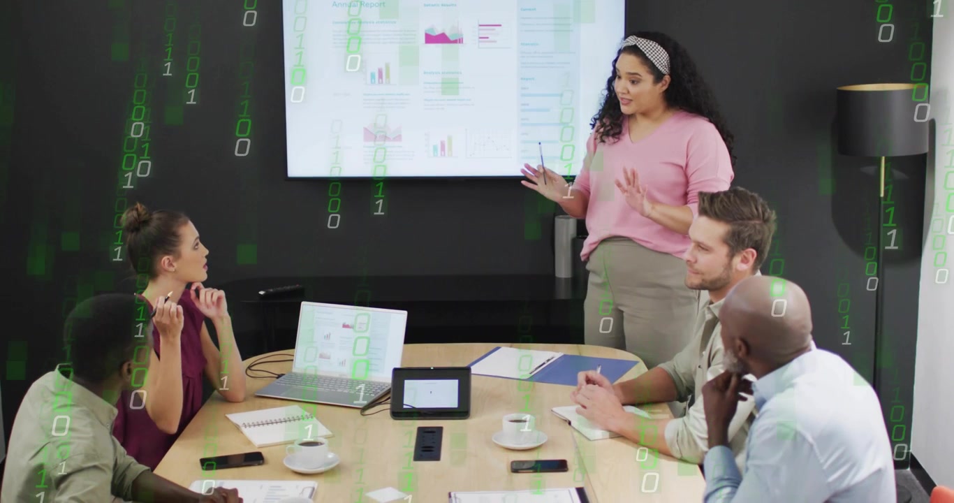 Presenter using pointer highlighting charts and activating green code overlay in business meeting