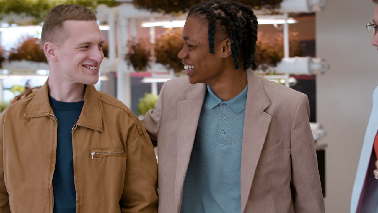 Happy Friends Enjoying Conversation in Modern Retail Space
