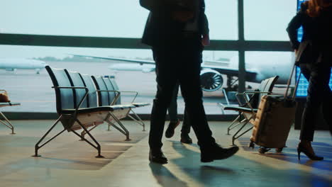 people waiting at airport departure lounge