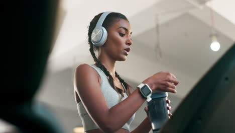 treadmill, running or woman drinking water in gym