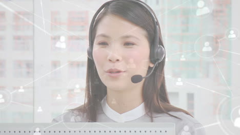 animation of networks of connections with icons over businesswoman using phone headsets