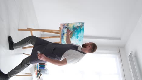 the process of creating an oil painting in the workshop by a professional artist vertical video