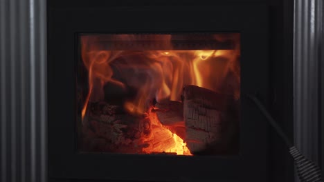 Close-up-of-a-wood-burning-fireplace-with-flames-of-red-and-yellow