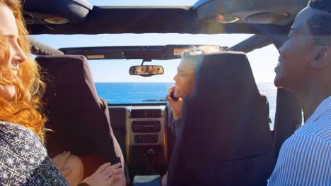 group of female friends interacting each other in the car 4k