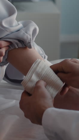 bandaging an arm wound