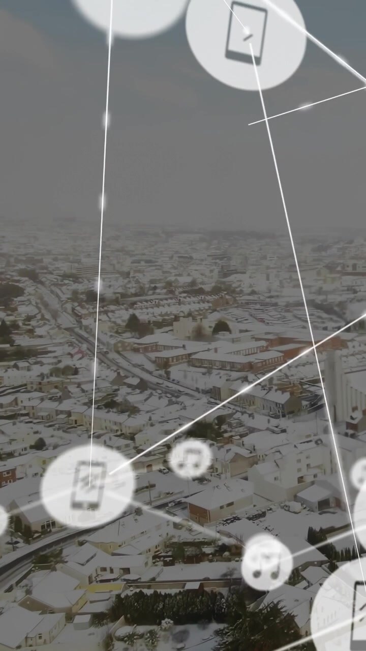 Upper-right phone and music icons spawning and moving over snowy town, forming glowing tech network