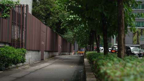 -Empty-sidewalk-on-a-side-street-in-Hong-Kong,-China