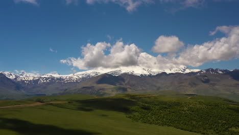 elbrus region. flying over a highland plateau. beautiful landscape of nature. mount elbrus is visible in the background.