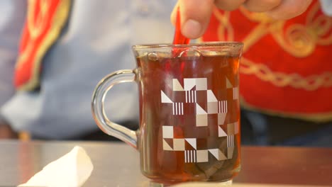 person serving turkish tea