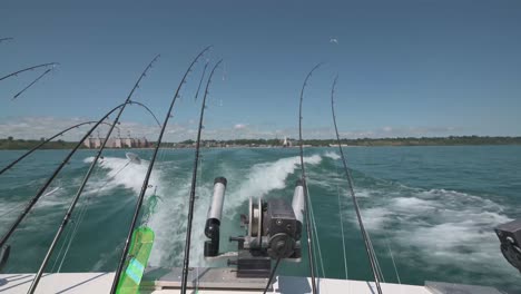 view towards the rear of a speeding fishing boat