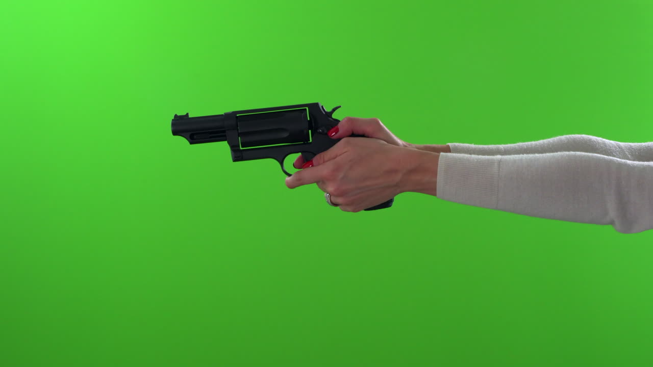 Female with red nails checking gun for ammo, cocking and then firing