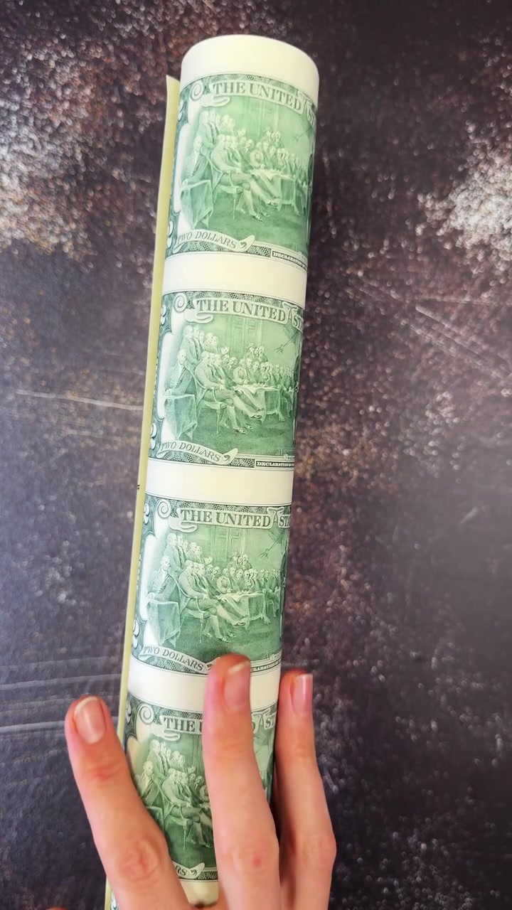 Pattern of souvenir two dollar bills. Flat lay pattern of souvenir two dollar bills arranged as repeating background.