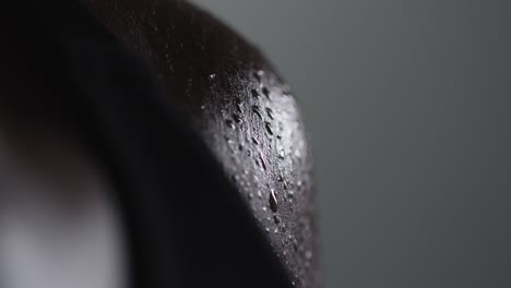 close up shot of beads of sweat on woman wearing gym fitness clothing exercising