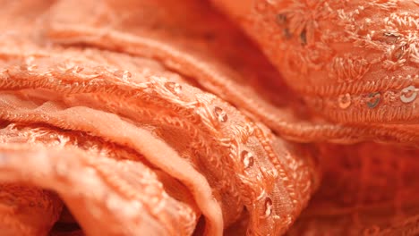 close-up view of embroidered orange fabric