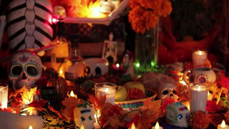 Offerings-and-elements-on-the-altar-for-Day-of-the-Dead,-establishing-tilt-up