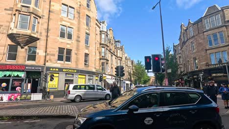 pedestrians and vehicles at a bustling intersection