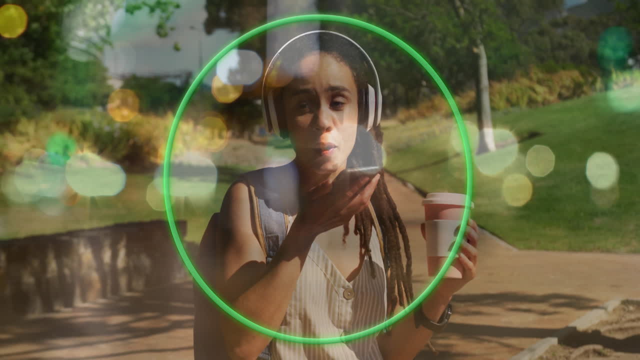 woman speaking into smartphone in park, showing marketing tech with green circle overlay