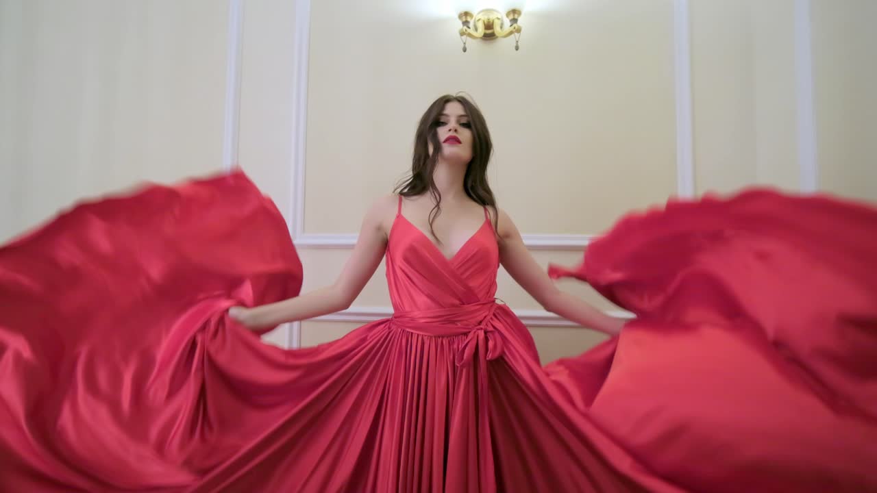 Elegant Woman in a Red Satin Gown