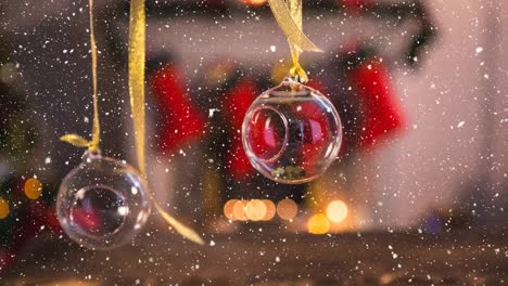 Animation-of-snow-falling-over-christmas-baubles