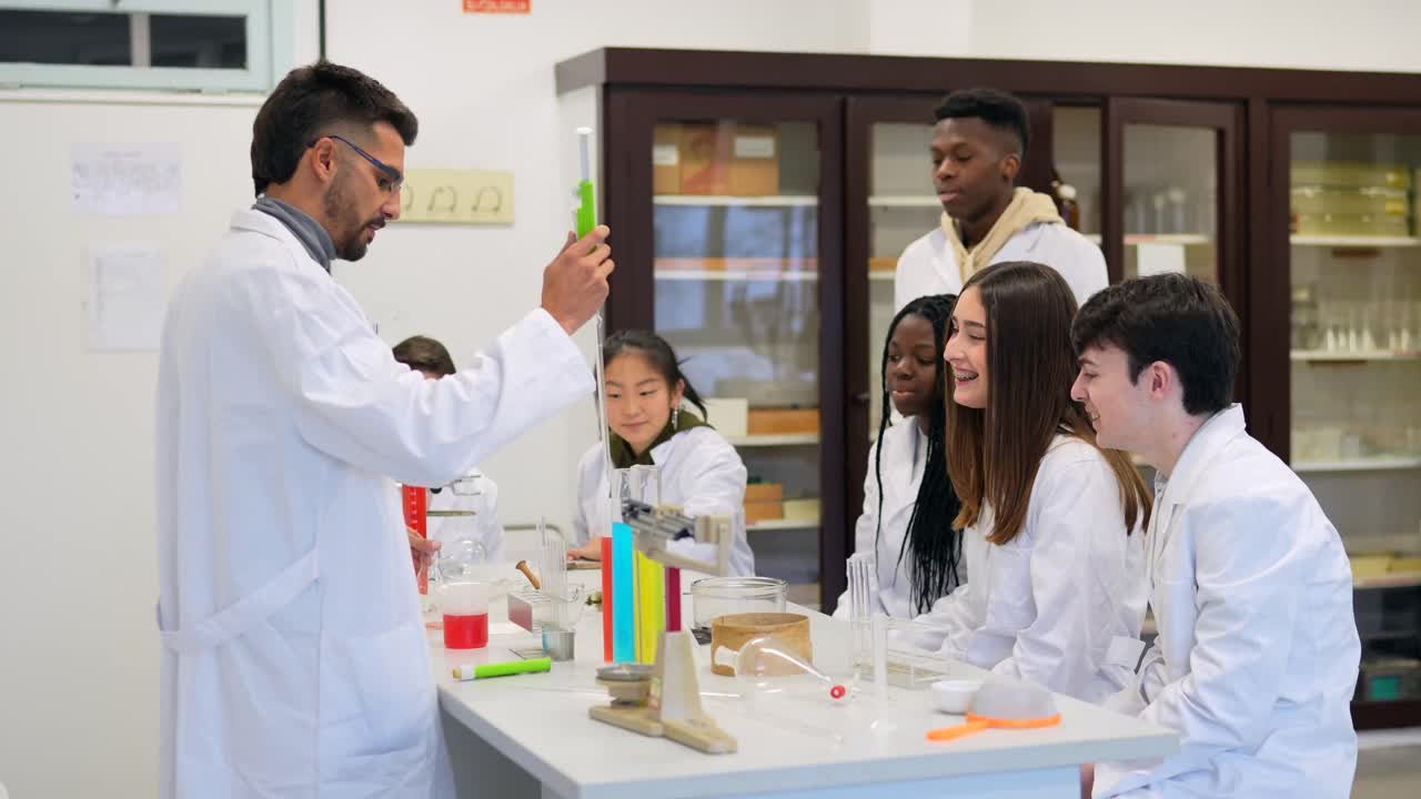 Students in a science class with their teacher performing an experiment