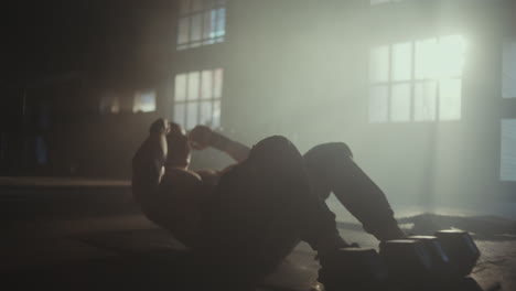 man doing sit-ups in gym