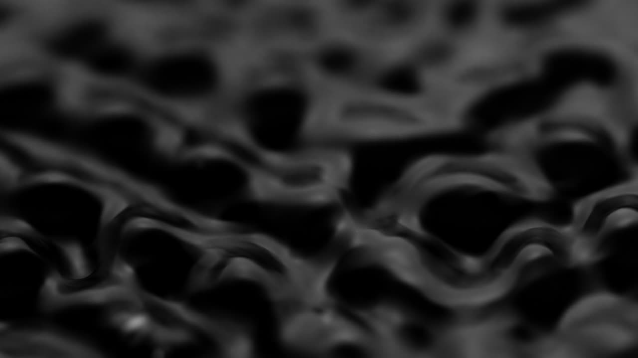 Splashes and drops on the surface of the liquid. Abstract Black Background Water vibration. 4K slow motion 100 fps, ProRes 422, 10 bit