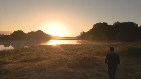 sunrise over a serene lake and forest