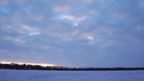 evening timelapse on the frozen water of silver beach lake