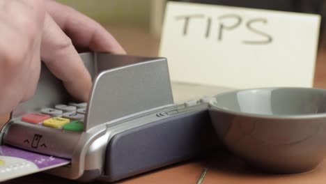 Paying-by-card-next-to-tipping-bowl