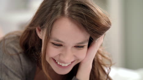 smiling woman touching hair