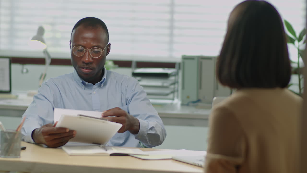 Black HR Manager Having Meeting Job Applicant in Office