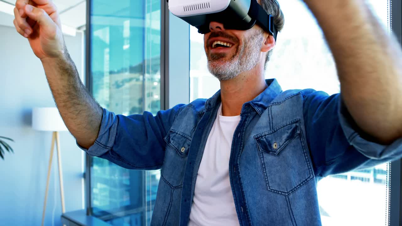 Male executive using virtual reality headset