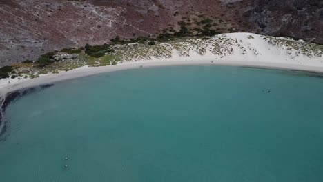 Aerial-panorama-view-at-a-distance-of-Balandra-beach-with-soothing-turquoise-waters-and-white-sand-in-Baja-California-Sur,-La-Paz,-Mexico