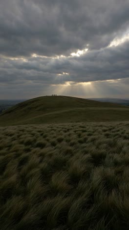 hilltop meadow with dramatic sky