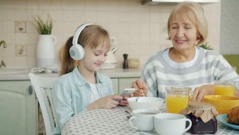 grandmother and granddaughter enjoying breakfast together