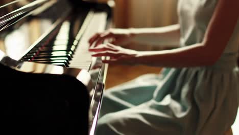 young woman playing the piano