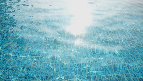 Big Infinity Pool With Chaise On Poolside Under The Sun