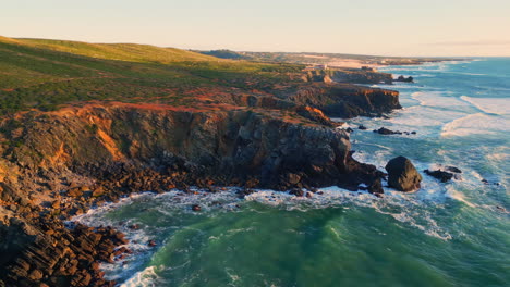 ocean swell grassy cliffs landscape aerial view. foaming waves rolling coastline