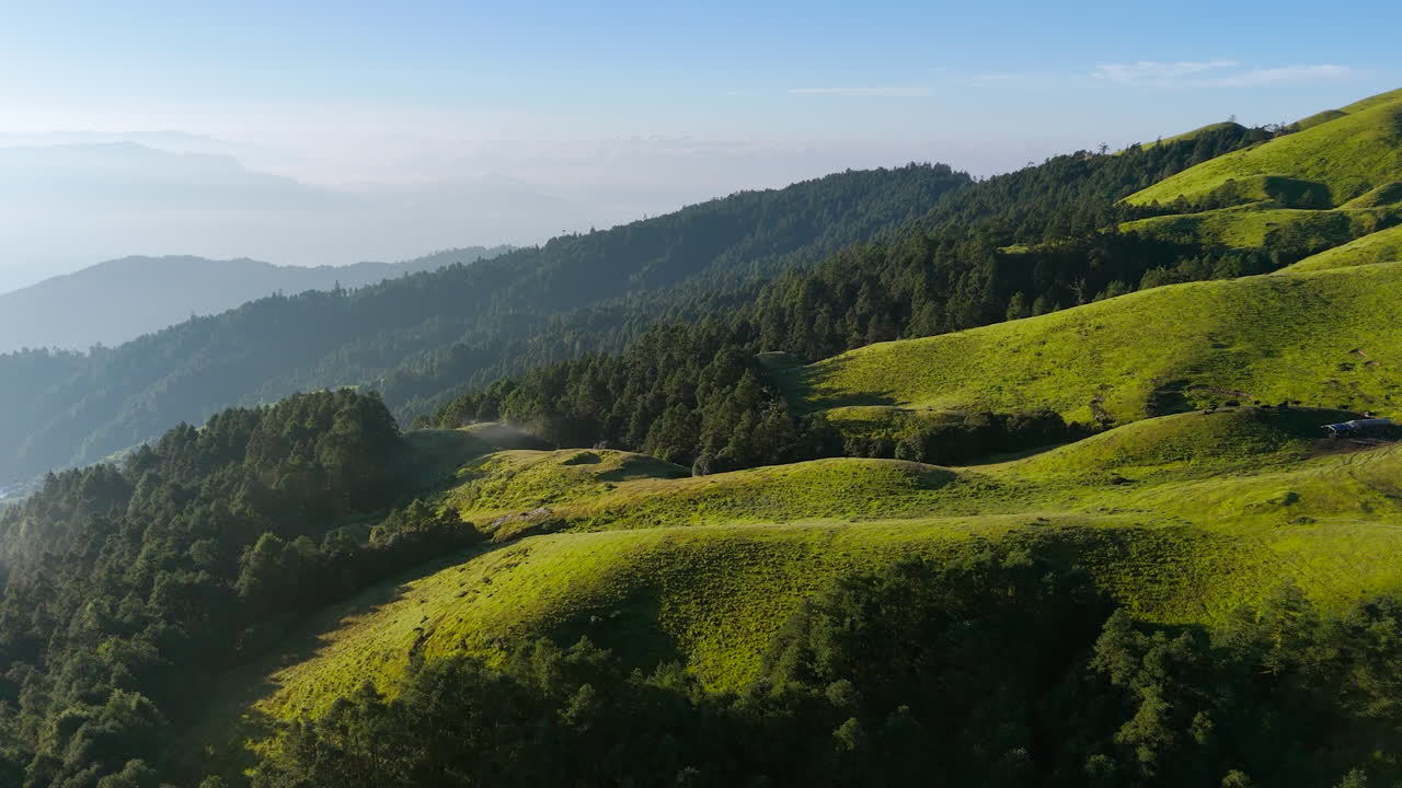 Aerial view of Nepal’s famous travel destination near Tibet border green hills sunny weather adventurous forest trails ideal spot for nature lovers seeking serene exploration and thrilling experience