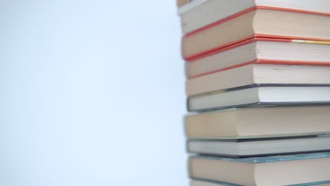 a stack of books on a bright background