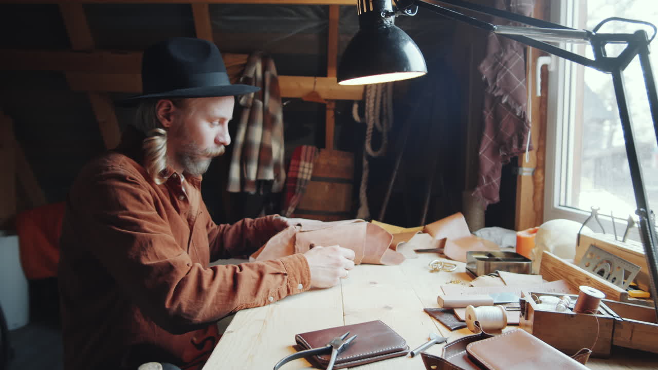 Craftsman Working with Leather in Workshop