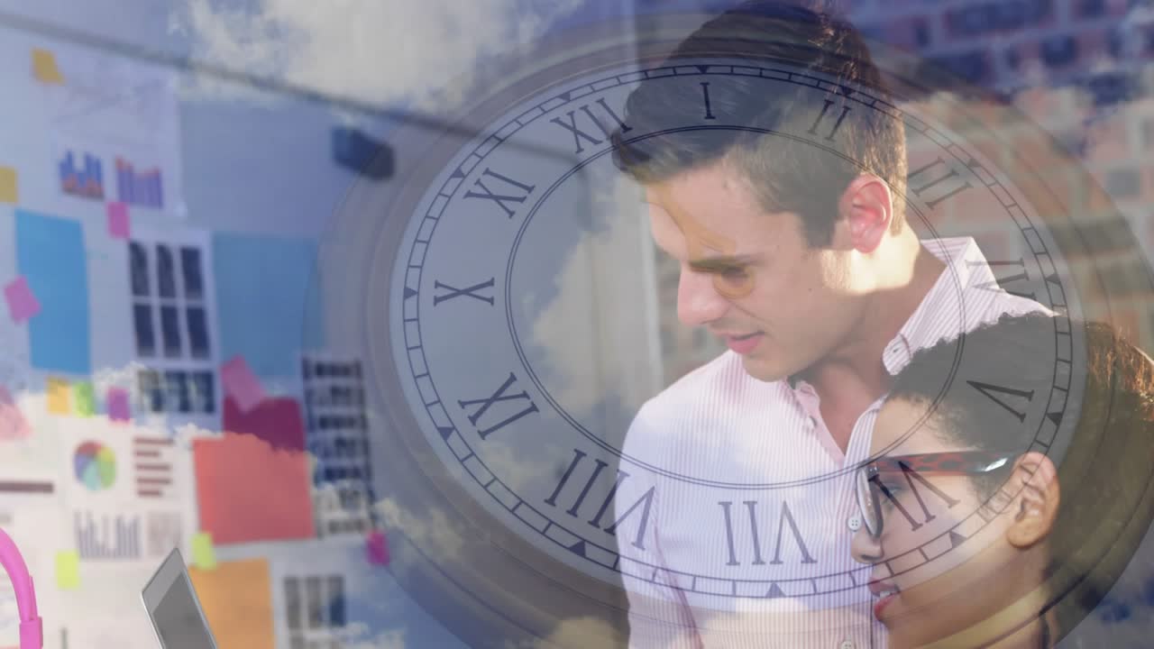 Coworkers opening laptop and starting clock cloud overlays while reviewing design project