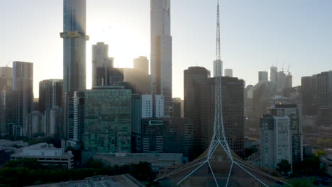 amazing light show aerial perspective of melbourne spire looking back towards the giant skyscrapers occupying southbank, melbourne, australia